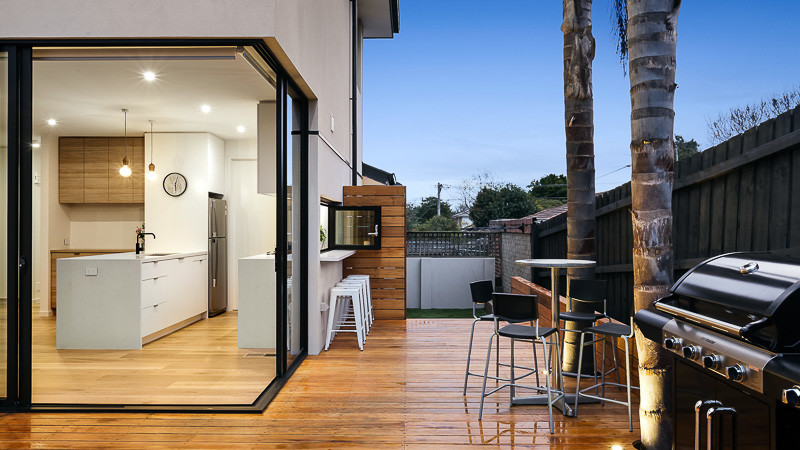 Photo of a mid-sized scandinavian backyard deck in Melbourne with no cover.