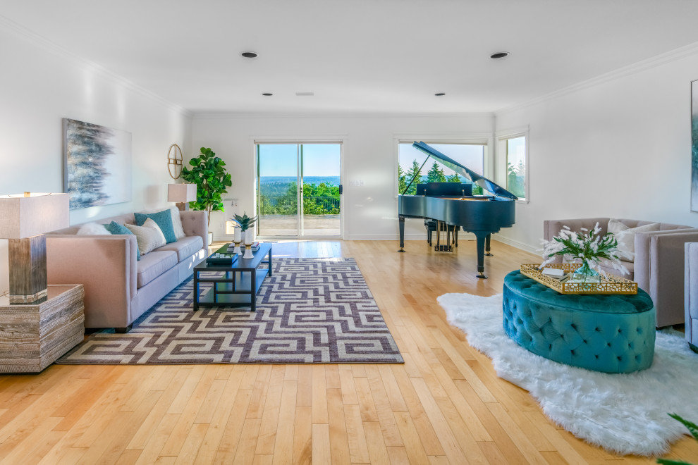 Design ideas for a beach style open concept family room in Seattle with white walls, light hardwood floors and beige floor.
