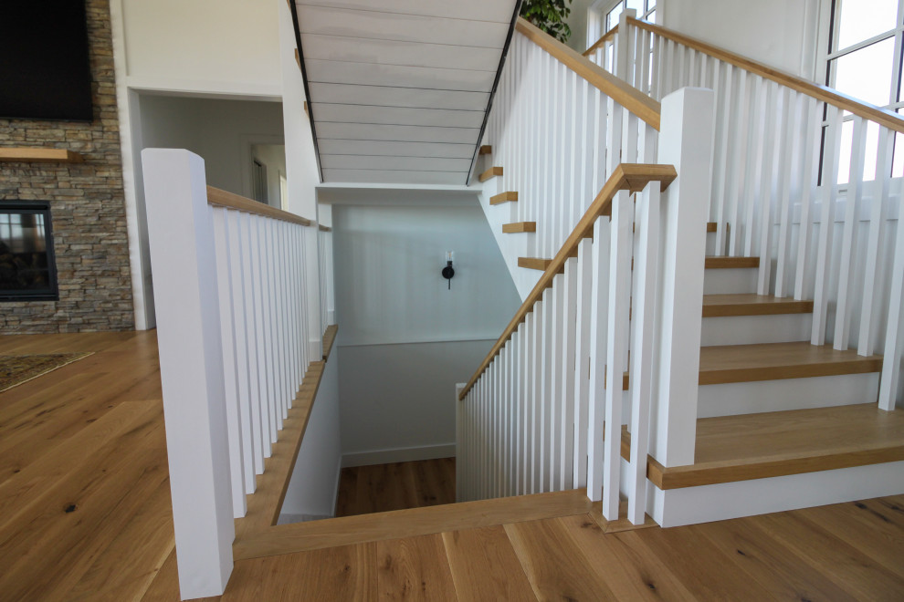 Staircase - mid-sized country wooden u-shaped wood railing and shiplap wall staircase idea in DC Metro with wooden risers