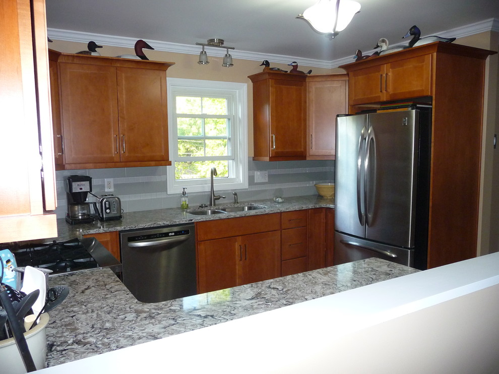 Eat-in kitchen - transitional eat-in kitchen idea in Philadelphia with an undermount sink, recessed-panel cabinets, medium tone wood cabinets, quartz countertops, ceramic backsplash and stainless steel appliances
