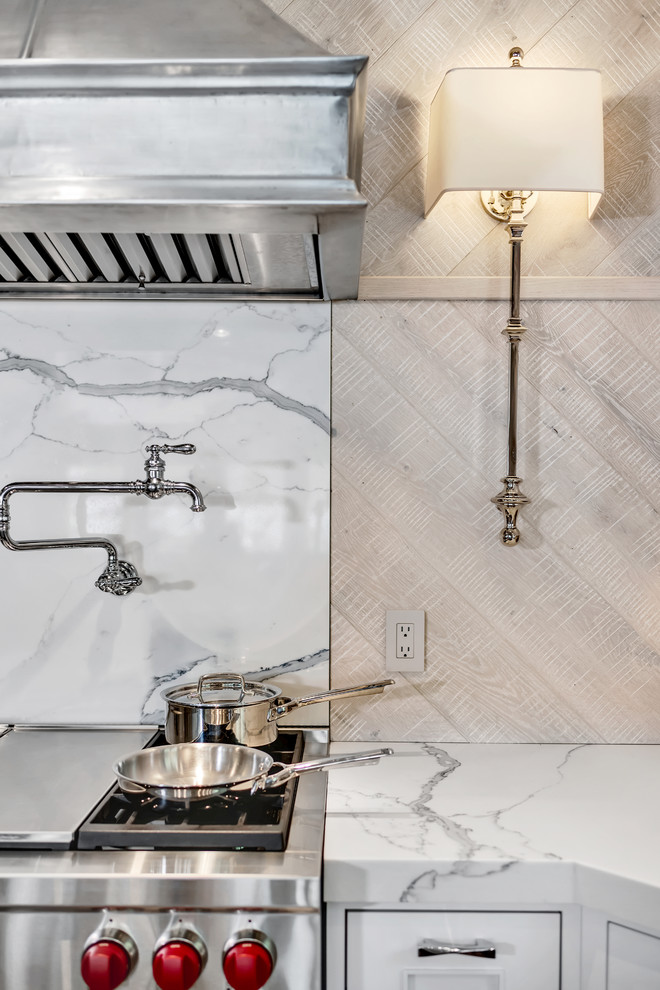 Inspiration for a rustic l-shaped brown floor and dark wood floor eat-in kitchen remodel with a farmhouse sink, recessed-panel cabinets, white cabinets, two islands, white countertops, quartzite countertops, white backsplash, stone slab backsplash and stainless steel appliances