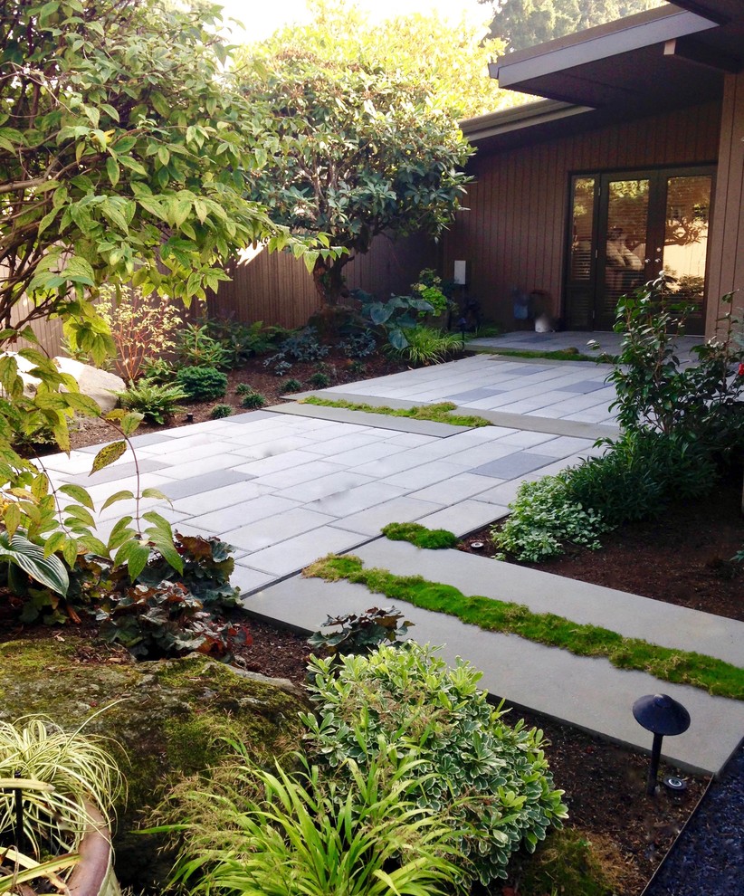 Patio - large modern courtyard patio idea in Seattle