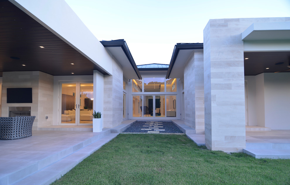 This is an example of a contemporary exterior in Miami.