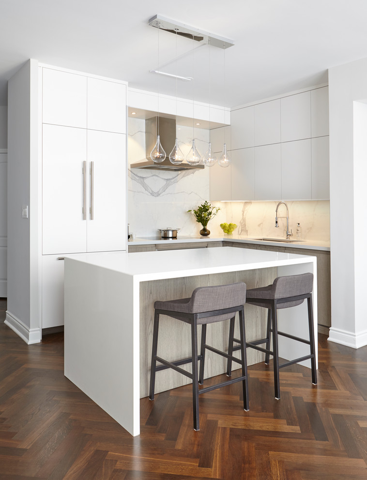 Kitchen - mid-sized modern l-shaped dark wood floor kitchen idea in Toronto with an undermount sink, flat-panel cabinets, quartz countertops, white backsplash, porcelain backsplash, paneled appliances, an island and white cabinets