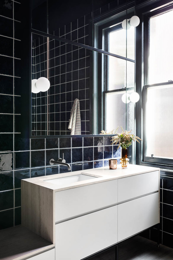 Inspiration for a contemporary bathroom in Melbourne with blue tile, blue walls, wood benchtops and an open shower.