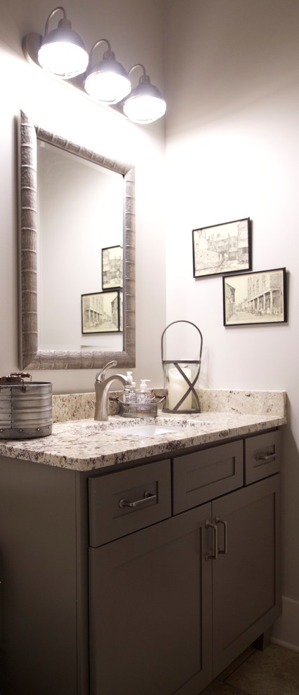 Example of a mid-sized mountain style kids' beige tile and porcelain tile porcelain tile alcove bathtub design with shaker cabinets, green cabinets, granite countertops and a two-piece toilet