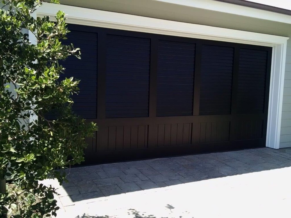 Photo of a mid-sized beach style attached two-car garage in Orange County.