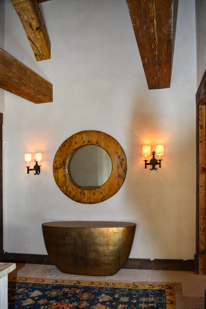Inspiration for a mid-sized rustic foyer remodel in Denver with white walls