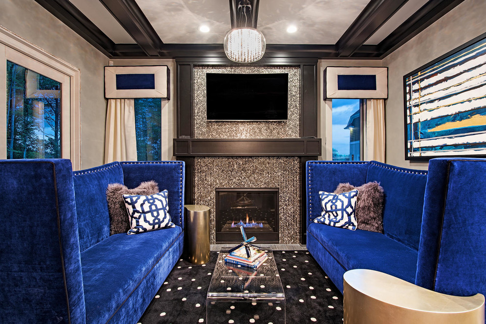 Inspiration for a mid-sized transitional enclosed home theatre in Cleveland with grey walls and a wall-mounted tv.