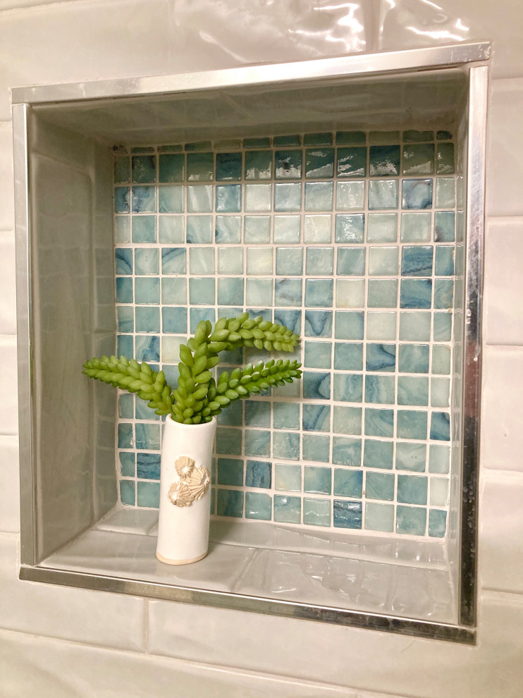 Inspiration for a small beach style master bathroom in Boston with shaker cabinets, an alcove shower, blue tile, blue walls, porcelain floors, an undermount sink, engineered quartz benchtops, a hinged shower door, blue benchtops, a single vanity, green cabinets, a two-piece toilet, subway tile, grey floor and a freestanding vanity.