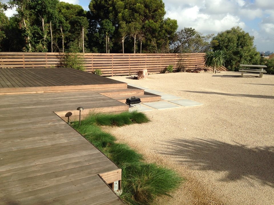 Photo of a midcentury backyard xeriscape in San Francisco with decking.