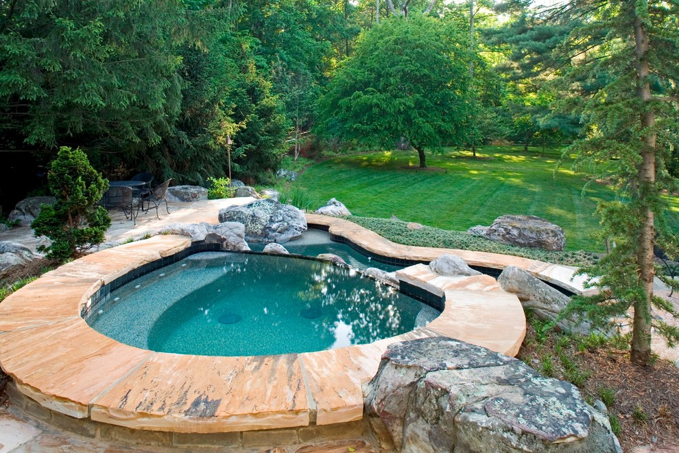 Pool - mid-sized rustic backyard custom-shaped and stone lap pool idea in DC Metro