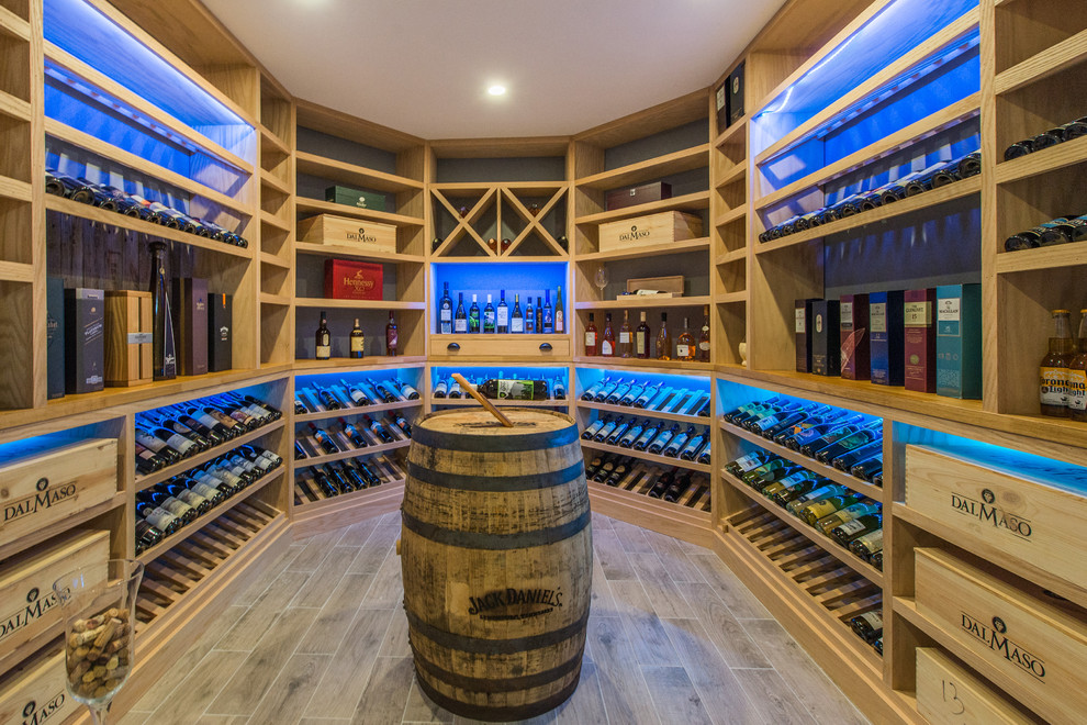 Design ideas for a traditional wine cellar in New York with display racks and brown floor.