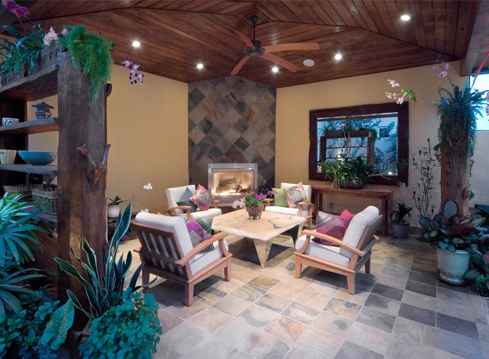 This is an example of a traditional patio in Orlando with a fire feature.