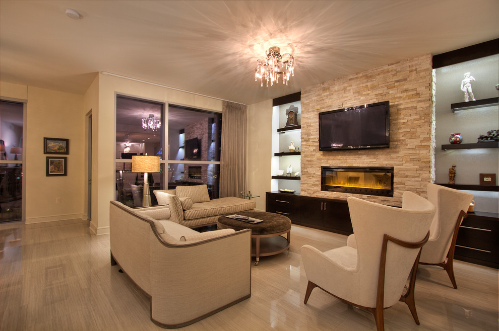 This is an example of a mid-sized modern open concept living room in Miami with white walls, porcelain floors, a ribbon fireplace, a tile fireplace surround, a wall-mounted tv and grey floor.