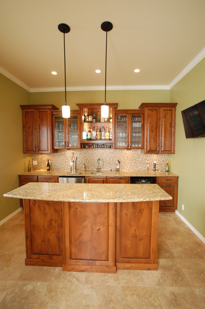 This is an example of a small contemporary home bar in Boise.