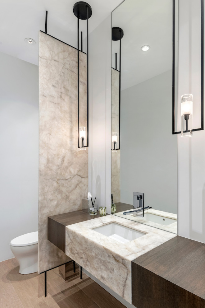 Photo of a contemporary powder room in Phoenix with an undermount sink, beige floor and a floating vanity.