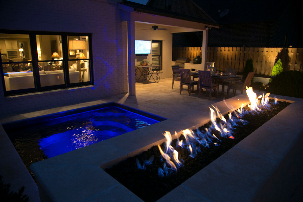Small backyard rectangular pool in Birmingham with natural stone pavers.