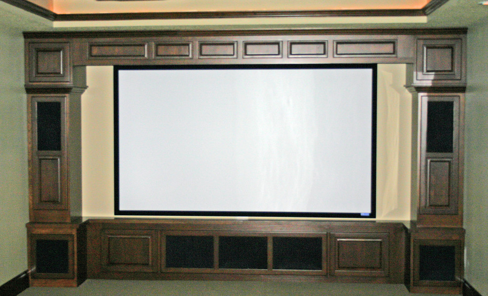 Inspiration for a large traditional enclosed home theatre in Minneapolis with green walls, carpet and a projector screen.
