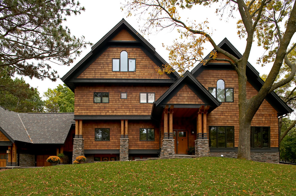 Photo of an arts and crafts exterior in Minneapolis with wood siding.