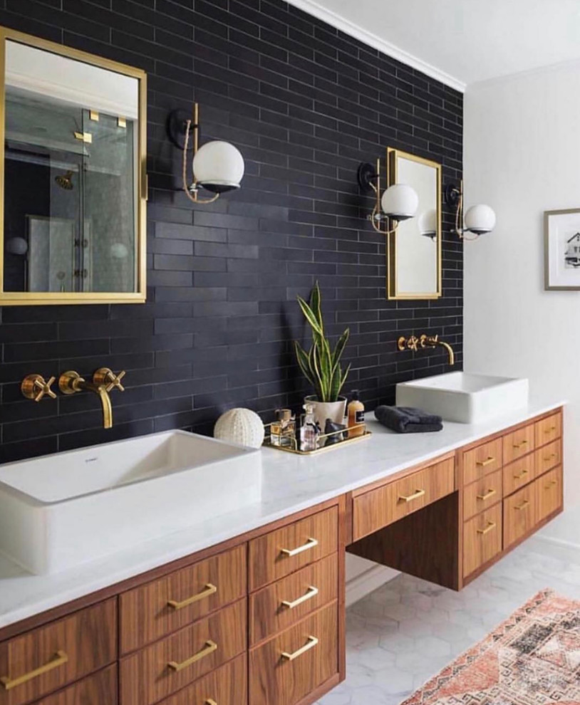 This is an example of a contemporary master bathroom in DC Metro with flat-panel cabinets, medium wood cabinets, black tile, brown walls, a vessel sink, grey floor and white benchtops.