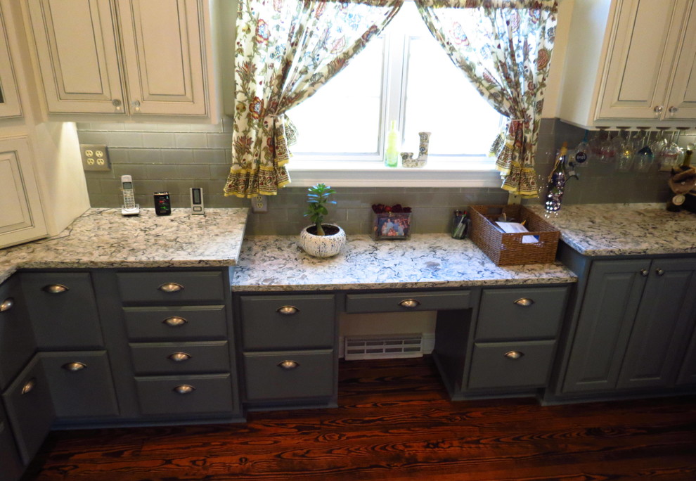 Design ideas for a large country kitchen in DC Metro with a farmhouse sink, raised-panel cabinets, beige cabinets, granite benchtops, blue splashback, subway tile splashback, stainless steel appliances, medium hardwood floors, with island and brown floor.