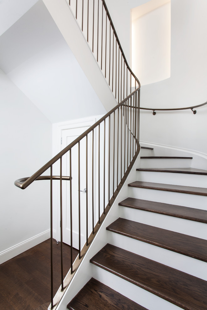 This is an example of a transitional curved staircase in New York.