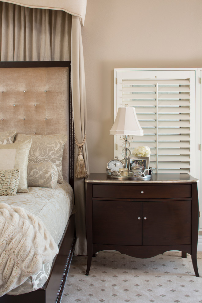 Inspiration for a large transitional master carpeted bedroom remodel in Orange County with beige walls, a standard fireplace and a plaster fireplace