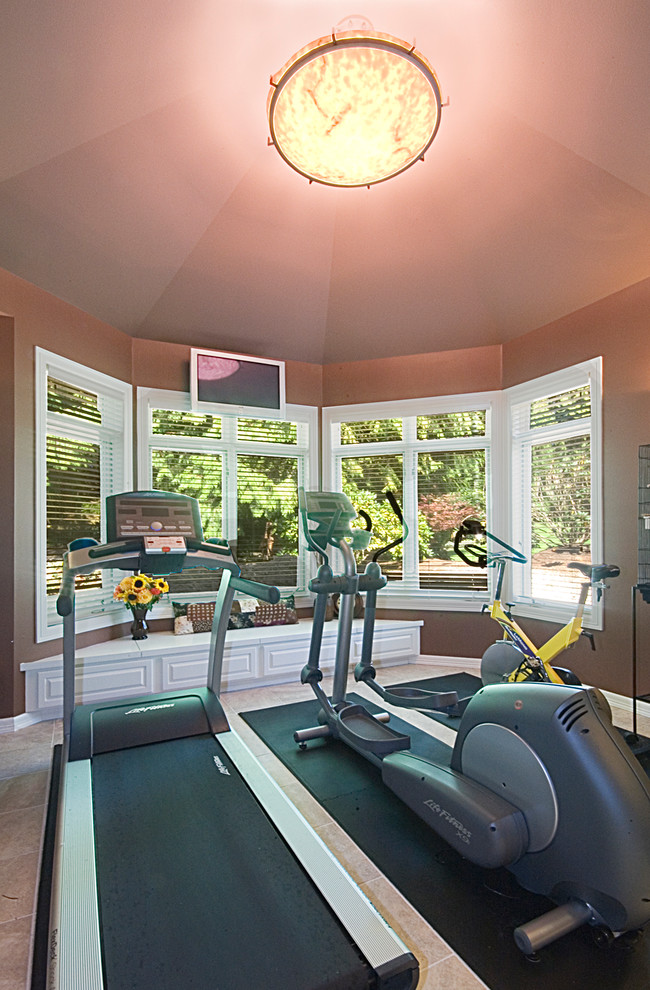 Inspiration for a mid-sized contemporary home weight room in Seattle with brown walls, ceramic floors and beige floor.