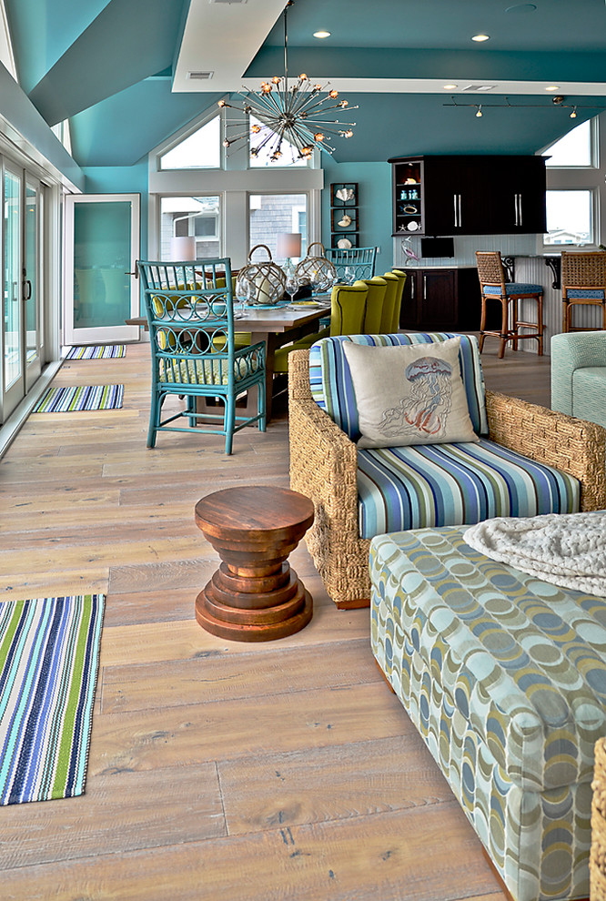 Photo of an expansive beach style open plan dining in Philadelphia with blue walls and light hardwood floors.