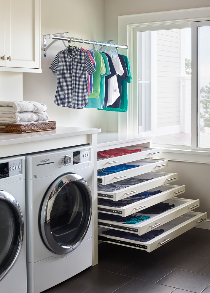 Photo of a beach style laundry room in Boston.