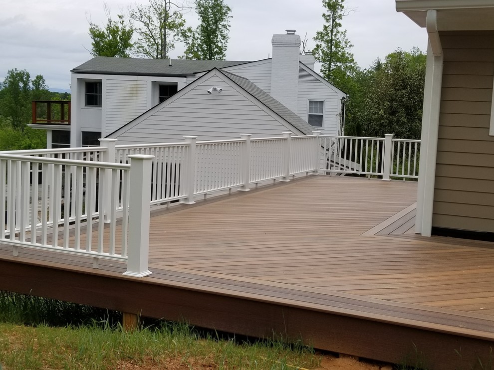 Mid-sized elegant backyard deck photo with no cover