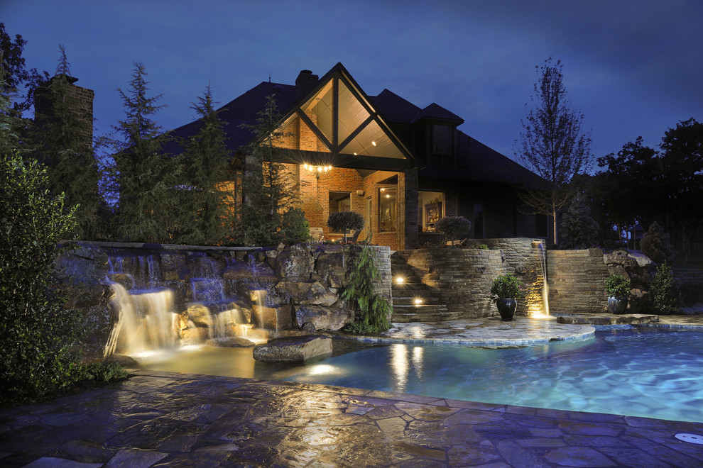 This is an example of a mediterranean custom-shaped pool in Oklahoma City.