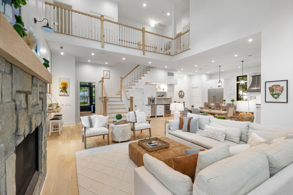 Living Room Seating Area with Stone Fireplace & Grand Staircase – Home Addition 