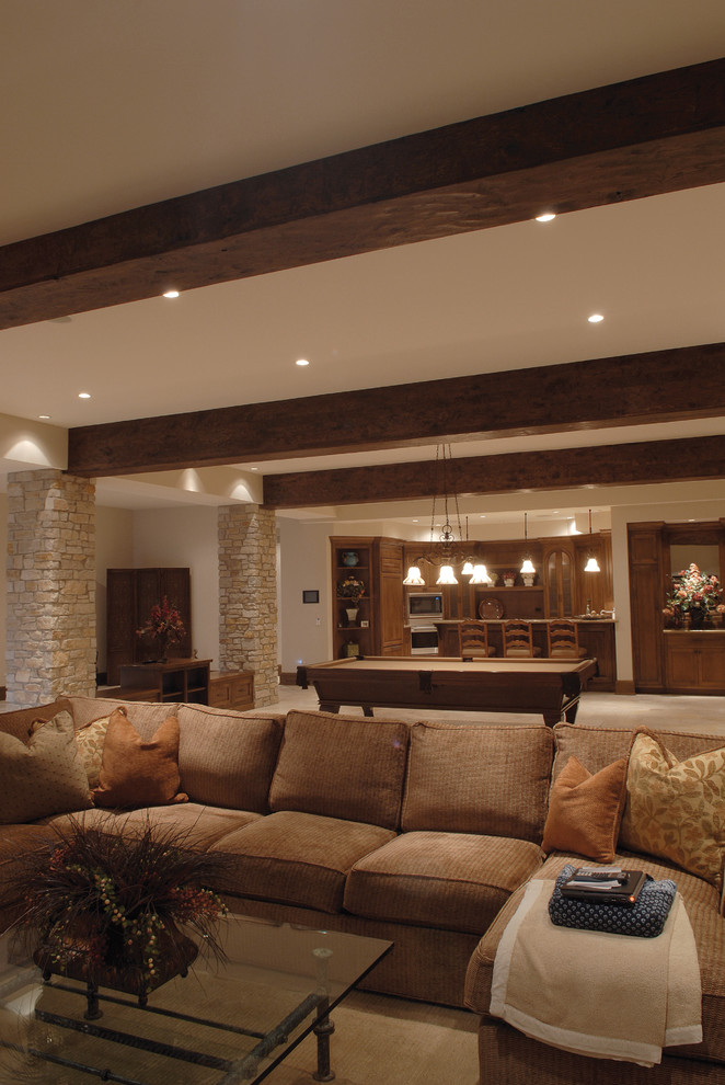 Photo of an expansive traditional family room in Chicago with a game room, a wall-mounted tv, exposed beam, ceramic floors and beige floor.