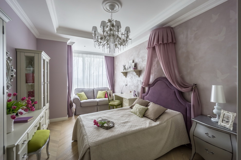 This is an example of a mid-sized transitional kids' room for girls in Moscow with purple walls and light hardwood floors.