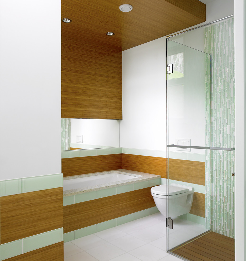 Inspiration for a contemporary bathroom in Vancouver with a curbless shower and a wall-mount toilet.