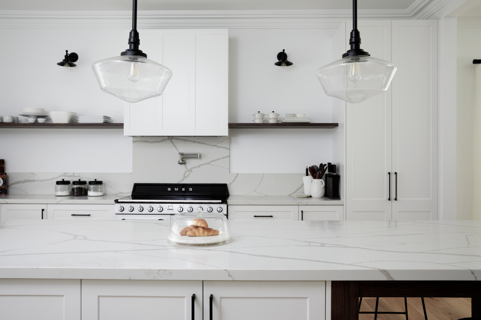 Shabby-chic style eat-in kitchen in Sydney with a farmhouse sink, quartz benchtops, white splashback, engineered quartz splashback, white appliances, light hardwood floors, with island, beige floor and white benchtop.