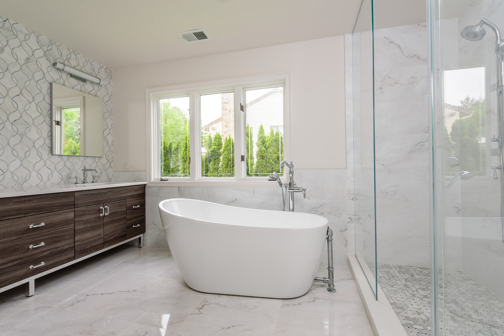 Design ideas for a large contemporary master bathroom in New York with furniture-like cabinets, brown cabinets, a freestanding tub, a double shower, a one-piece toilet, white tile, ceramic tile, white walls, ceramic floors, an undermount sink, engineered quartz benchtops, white floor, a hinged shower door and white benchtops.