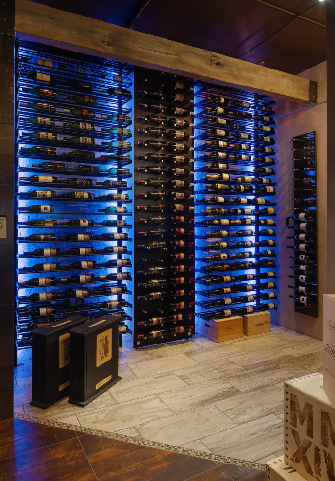 This is an example of a medium sized modern wine cellar in Phoenix with ceramic flooring, storage racks and multi-coloured floors.