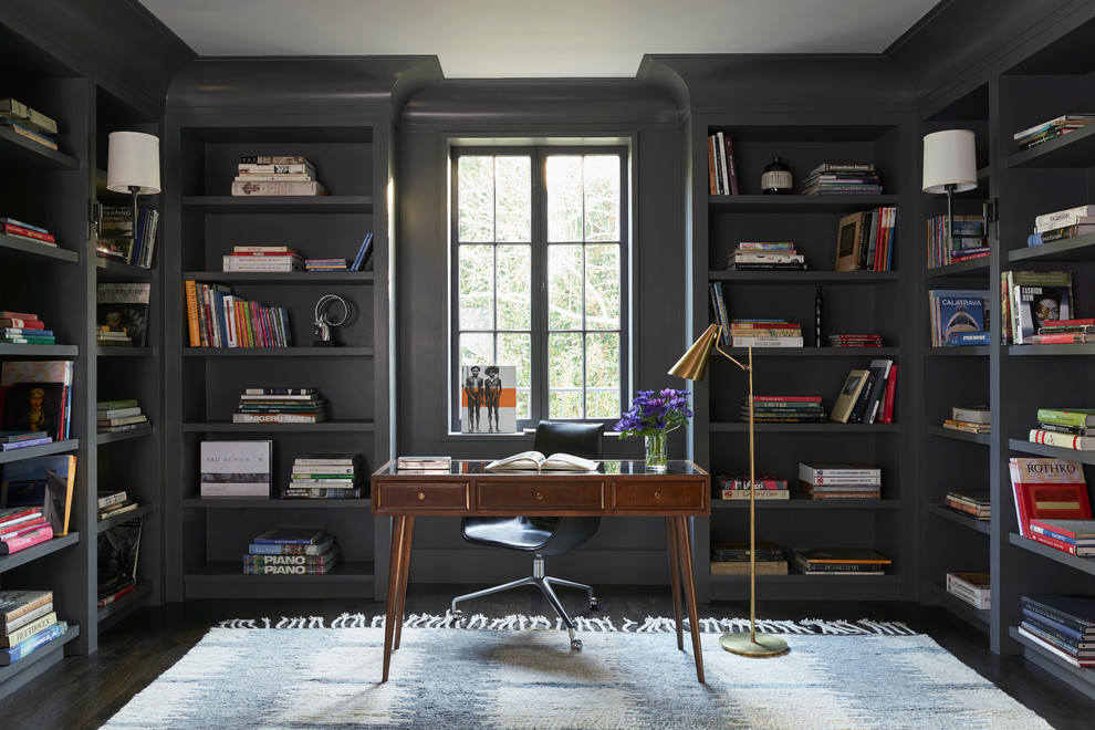 This is an example of a transitional study room in Los Angeles with grey walls, cork floors and a freestanding desk.