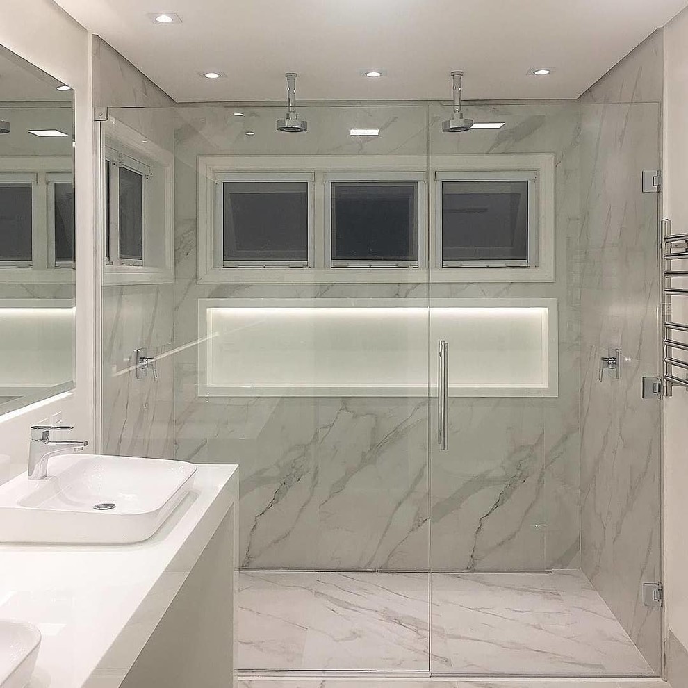 Inspiration for a mid-sized modern bathroom in San Francisco with flat-panel cabinets, white cabinets, a curbless shower, a two-piece toilet, white walls, concrete floors, a vessel sink, engineered quartz benchtops, grey floor, a hinged shower door, a double vanity and a built-in vanity.