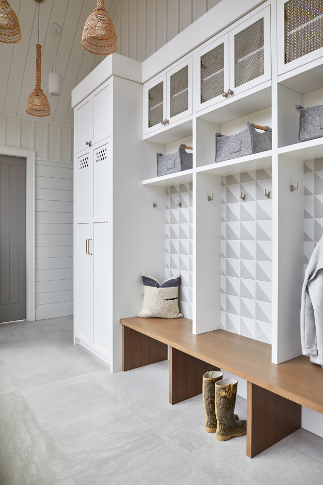 Inspiration for a large contemporary mudroom in Toronto with white walls, ceramic floors, a single front door, grey floor, vaulted and planked wall panelling.
