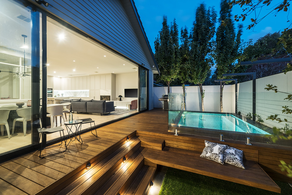 Photo of a mid-sized contemporary backyard garden in Melbourne with decking.