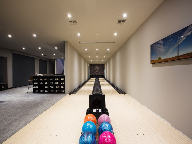 Example of a large minimalist enclosed carpeted and gray floor game room design in Las Vegas with beige walls and no tv