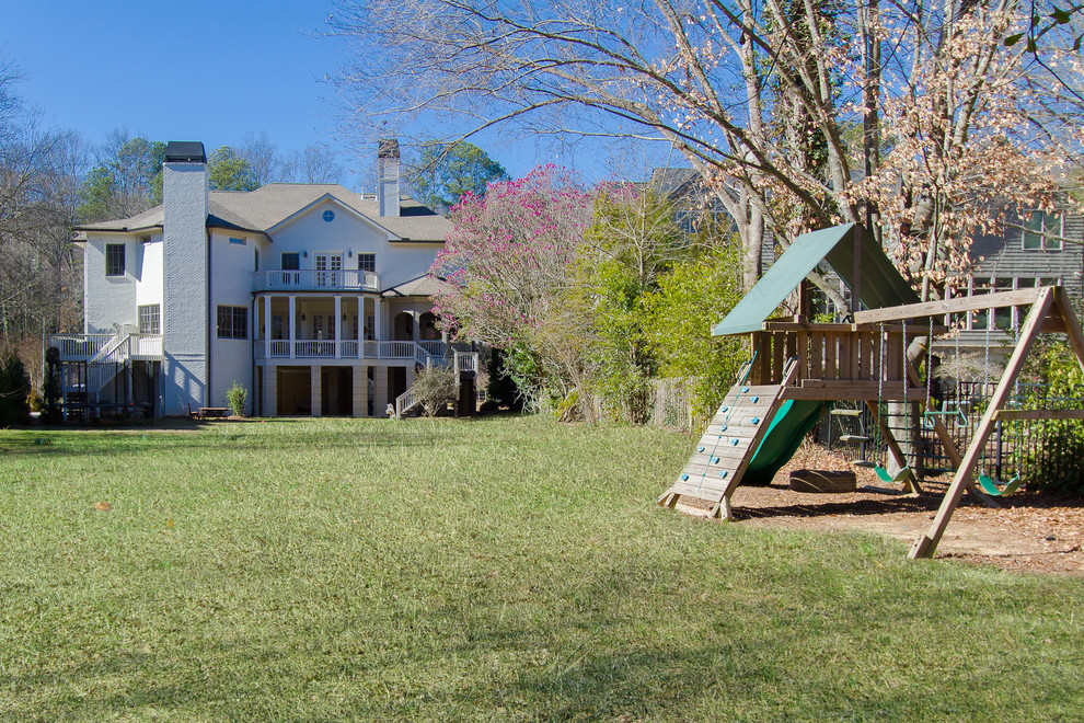 This is an example of a traditional garden in Atlanta with with outdoor playset.