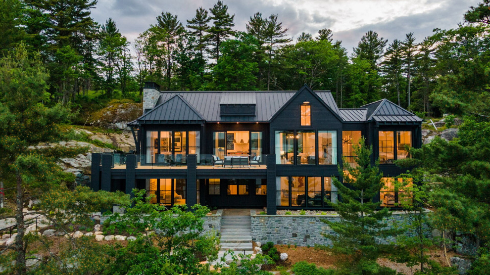 Inspiration for a transitional gray two-story wood exterior home remodel in Toronto with a metal roof and a gray roof