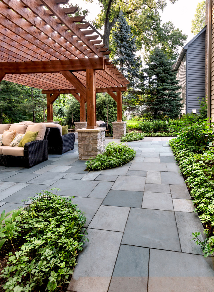 Inspiration for a traditional backyard shaded garden for summer in Chicago with a garden path and natural stone pavers.