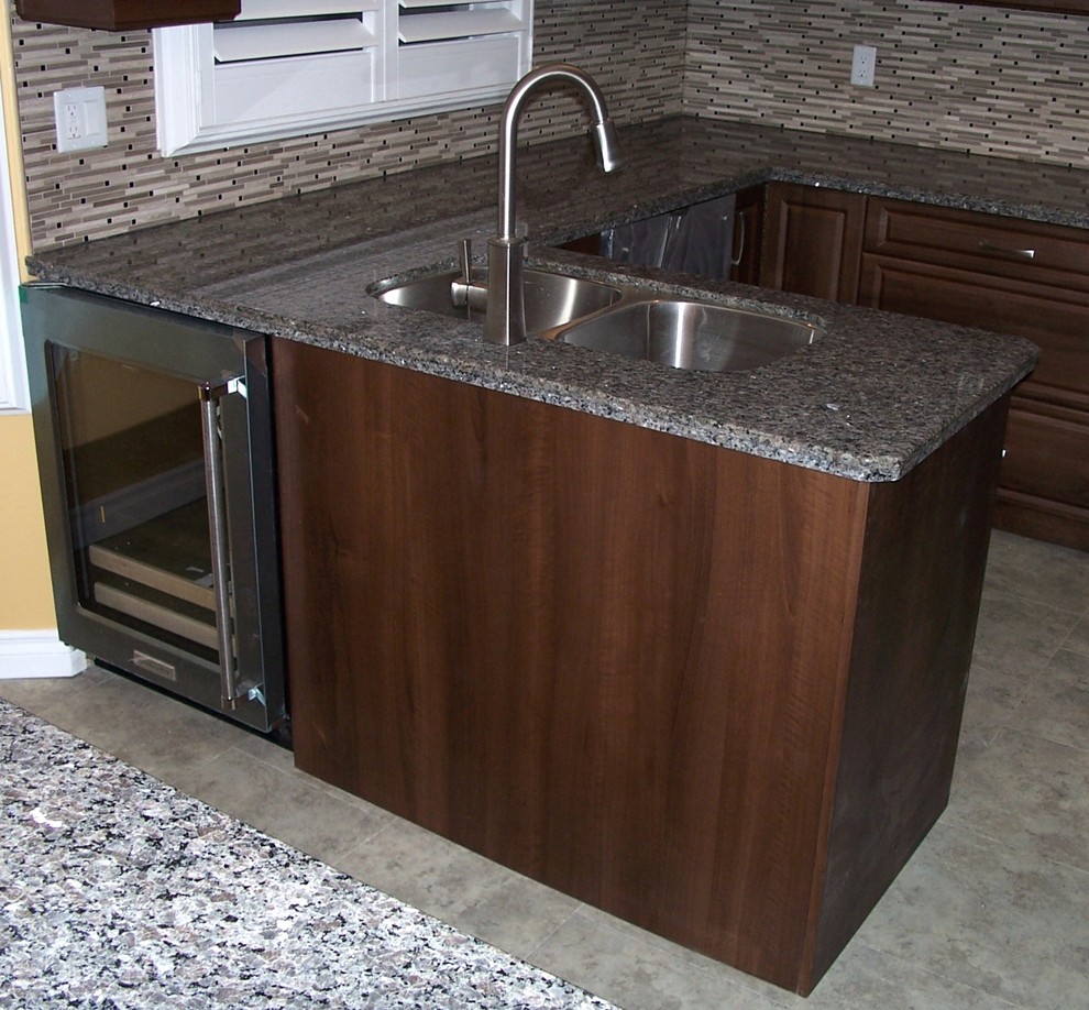 Example of a vinyl floor kitchen design in Toronto with granite countertops