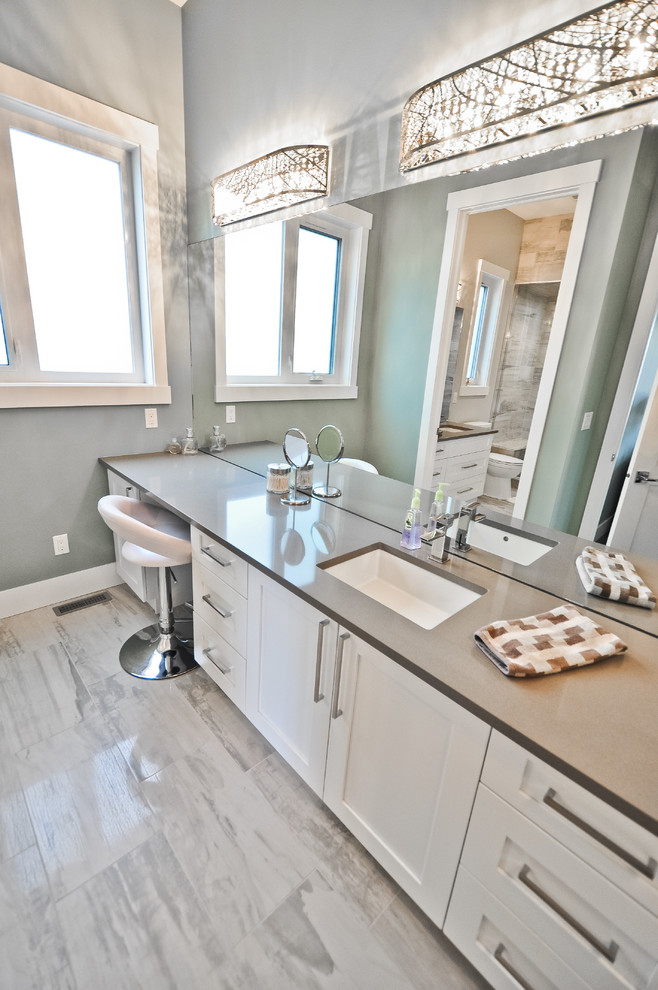 Transitional master gray tile and ceramic tile ceramic tile and gray floor alcove bathtub photo in Edmonton with shaker cabinets, white cabinets, gray walls, an undermount sink and quartzite countertops